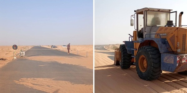 متطوعون يزيلون الرمال المتكدّسة على الطرق ب"بدر"