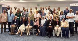 صورة جماعية للمشاركين في ورشة عمل تطوير منظومة التخطيط العمراني في ليبيا، المقامة بالعاصمة التونسية.