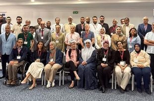 صورة جماعية للمشاركين في ورشة عمل تطوير منظومة التخطيط العمراني في ليبيا، المقامة بالعاصمة التونسية.