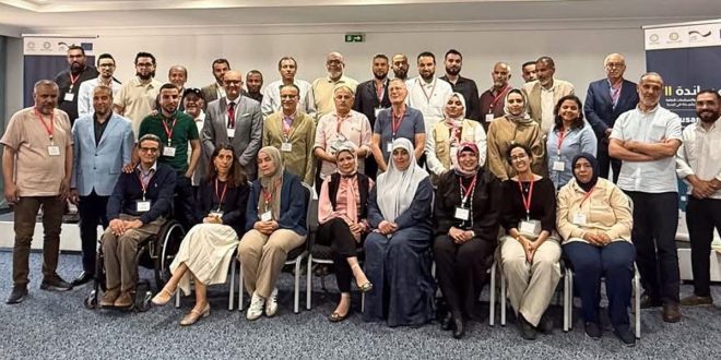 صورة جماعية للمشاركين في ورشة عمل تطوير منظومة التخطيط العمراني في ليبيا، المقامة بالعاصمة التونسية.