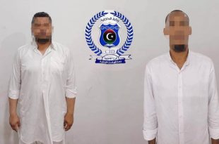 شعار جهاز المباحث الجنائية الليبي أو جانب من عمليات المتابعة والتحري الأمني بالمنطقة الجنوبية.